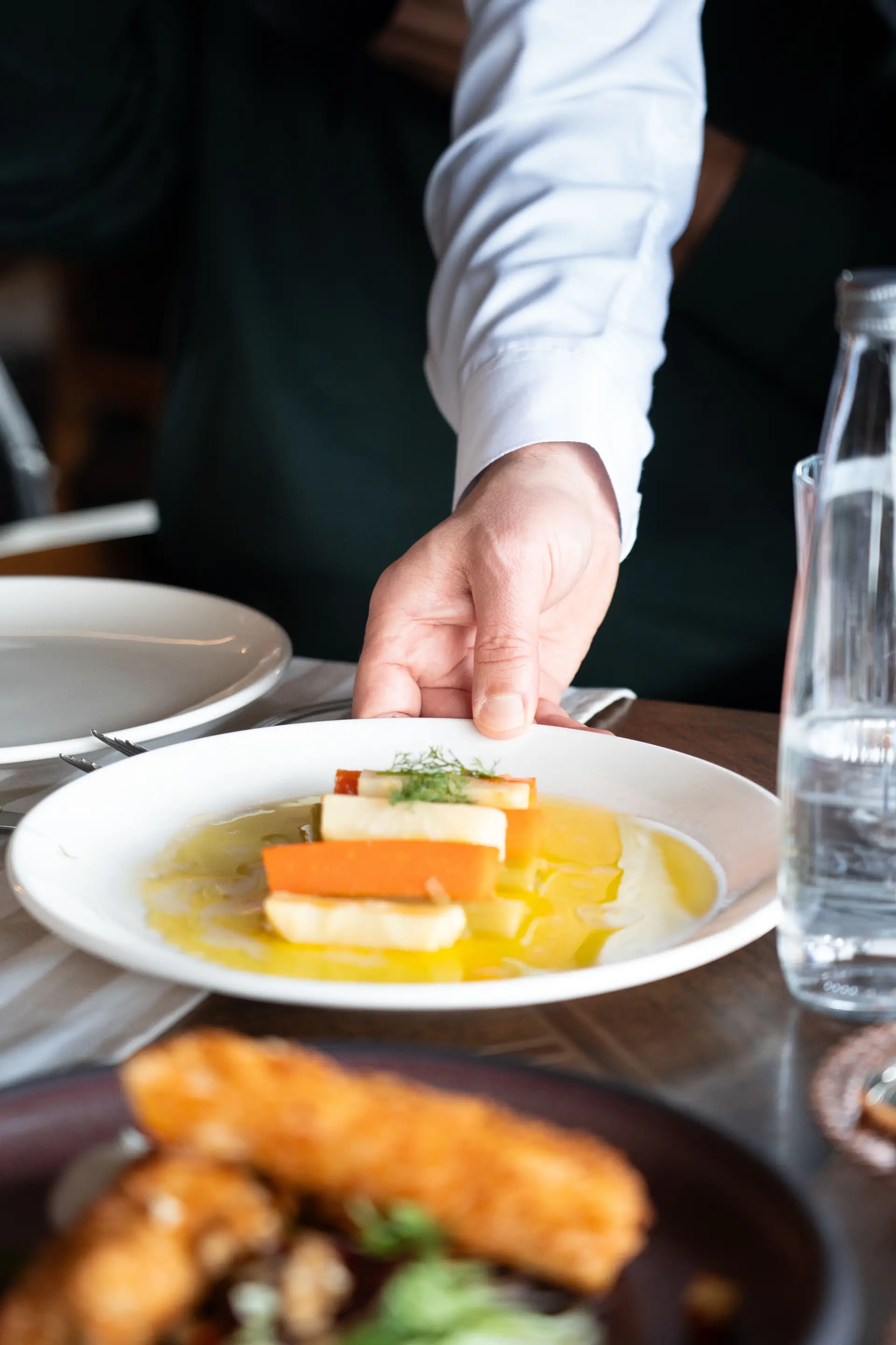 Chef plating gourmet dish